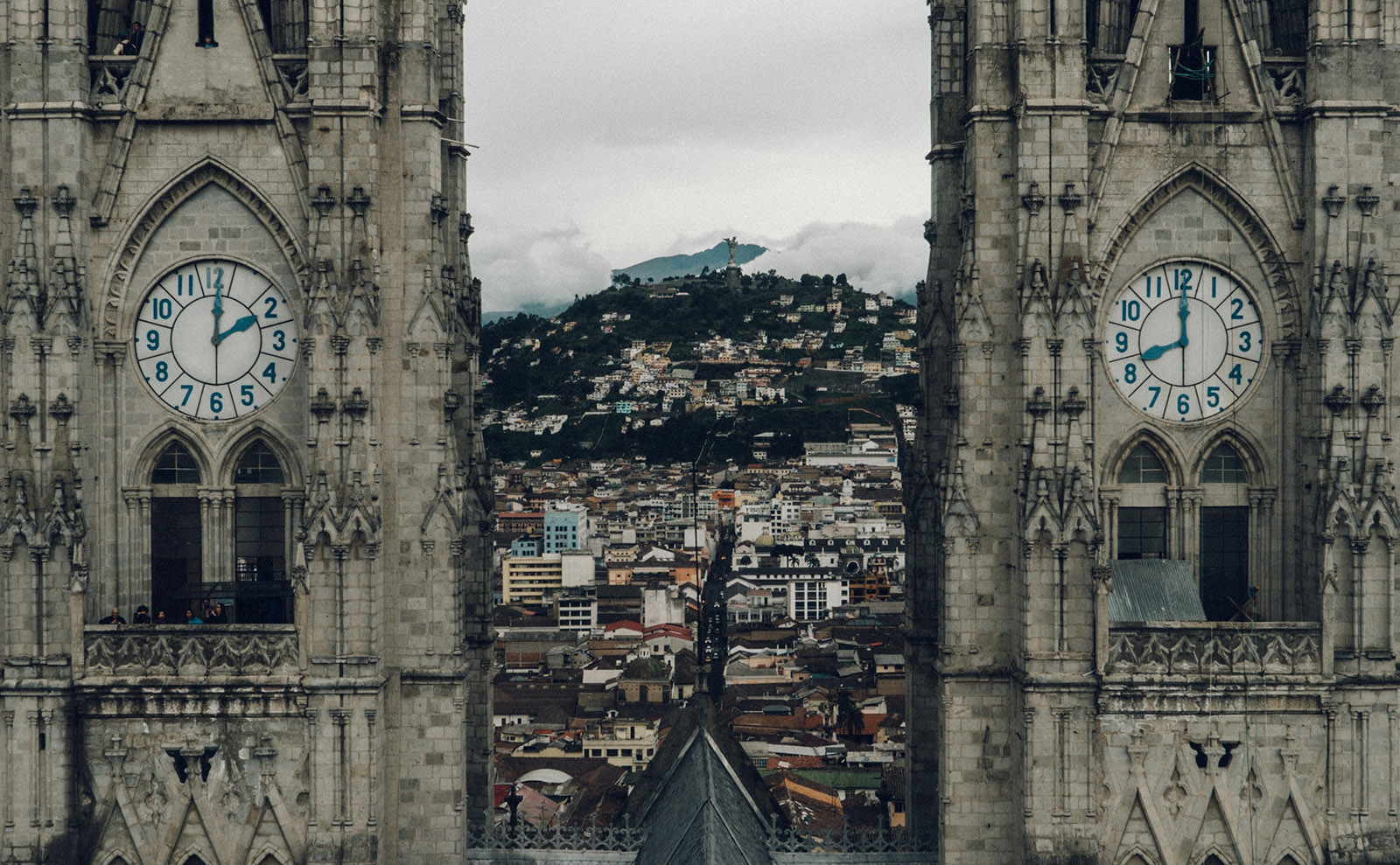 two church spires with white clocks