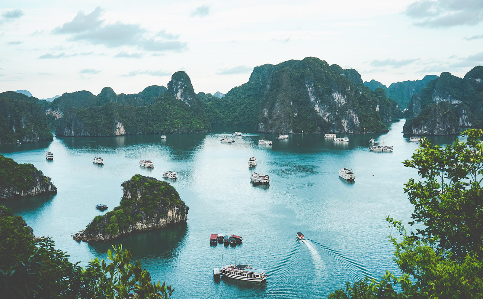 boats and limestone columns in halong bay, vietnam