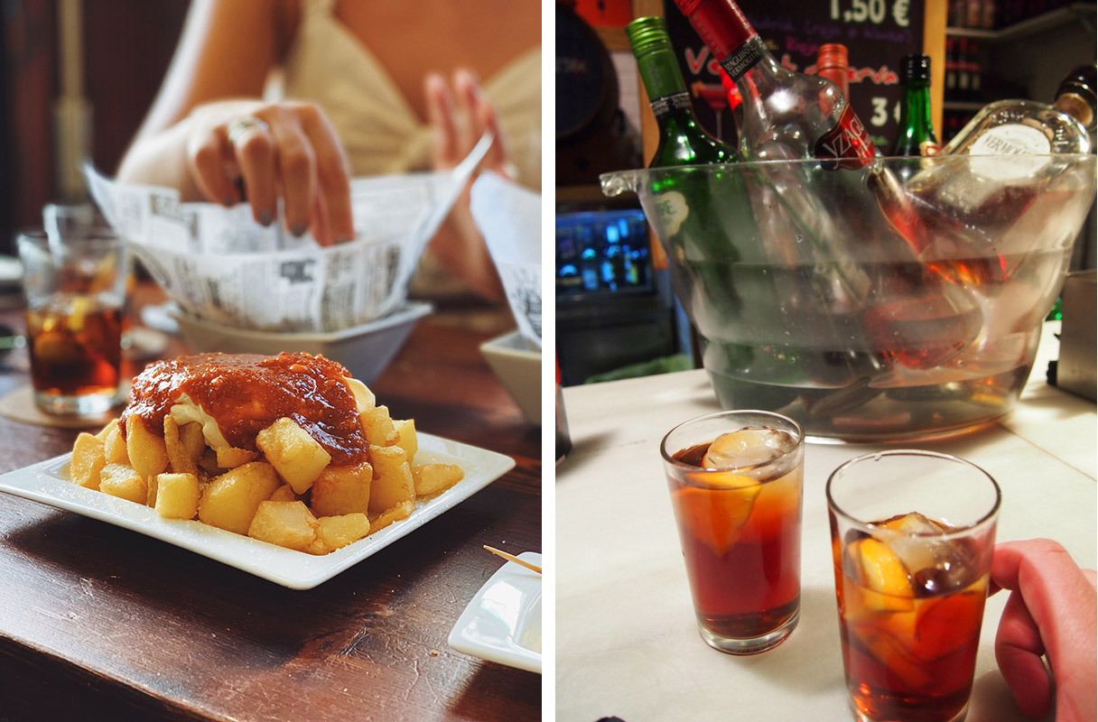 bowl of fried potato cubes with red spice sauce and a glass of brown-colored liquid with a slice of orange