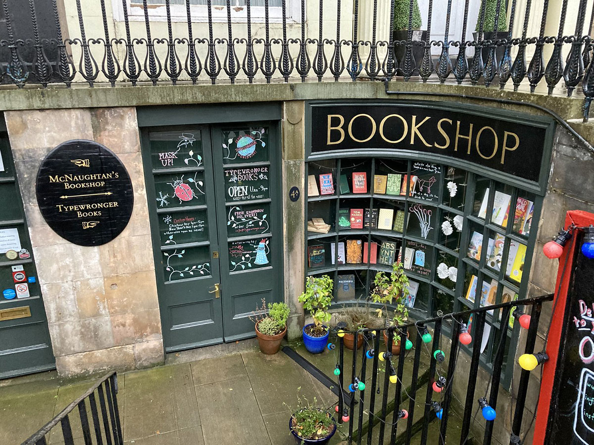 rows of window panes painted green with books visible inside