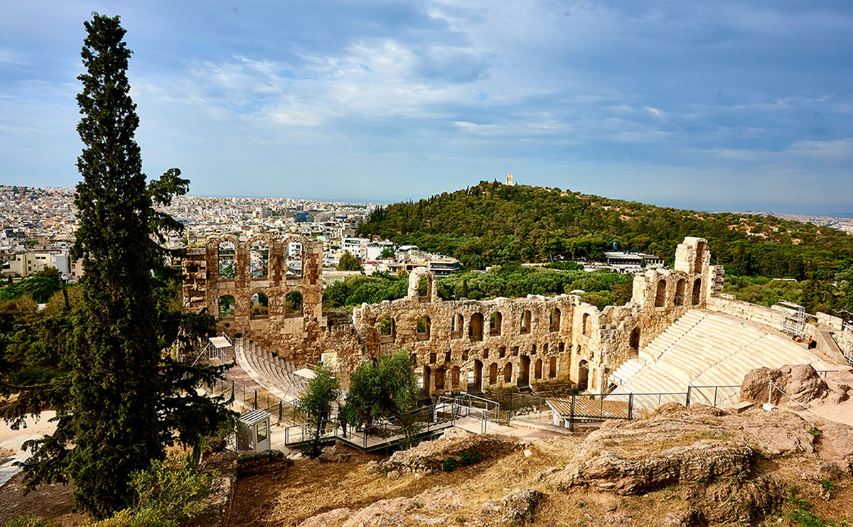 greek amphitheater under a sunny blue sky