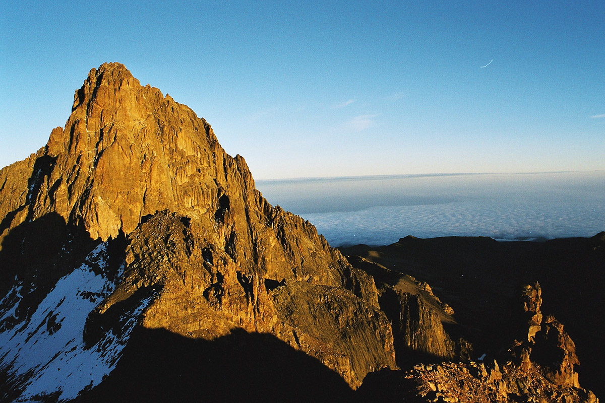 jagged peaks of mt kenya against a bright blue sky