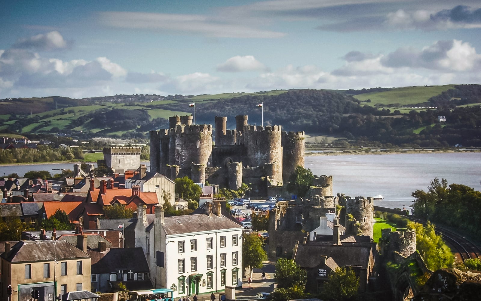 crenallated castle on the edge of a body of water