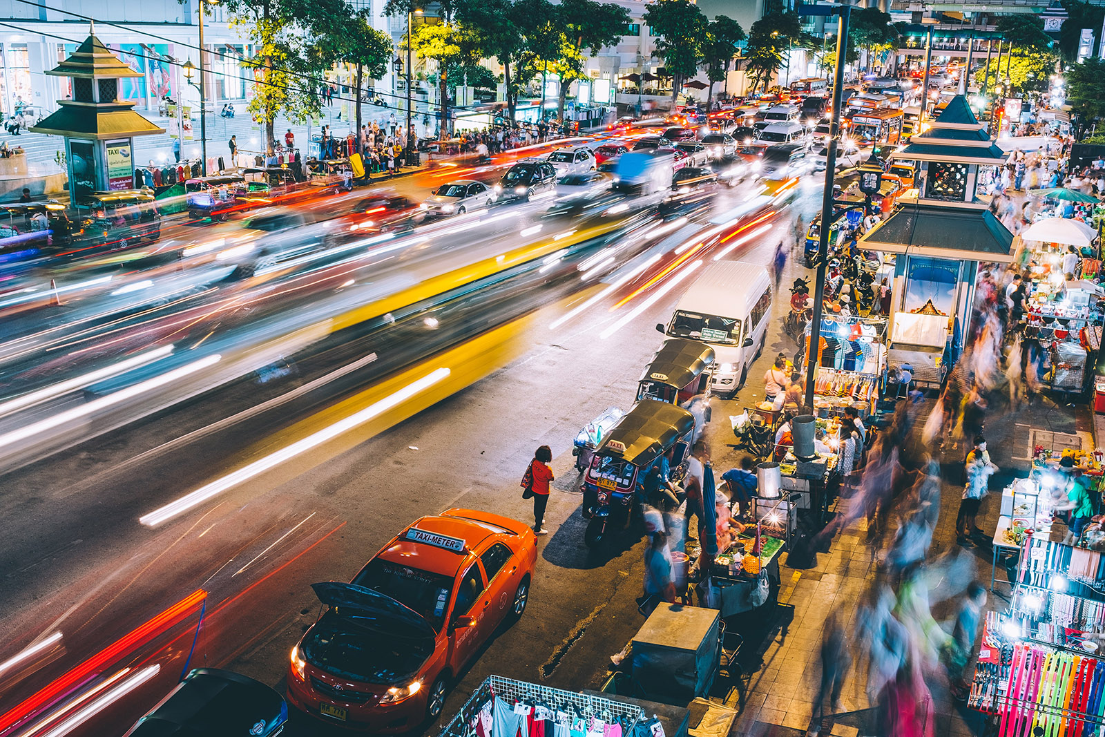 neon lights on night time street in bangkok thailand