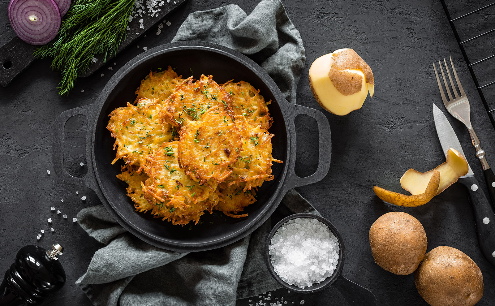 potato pancakes on a serving plate on a wooden table