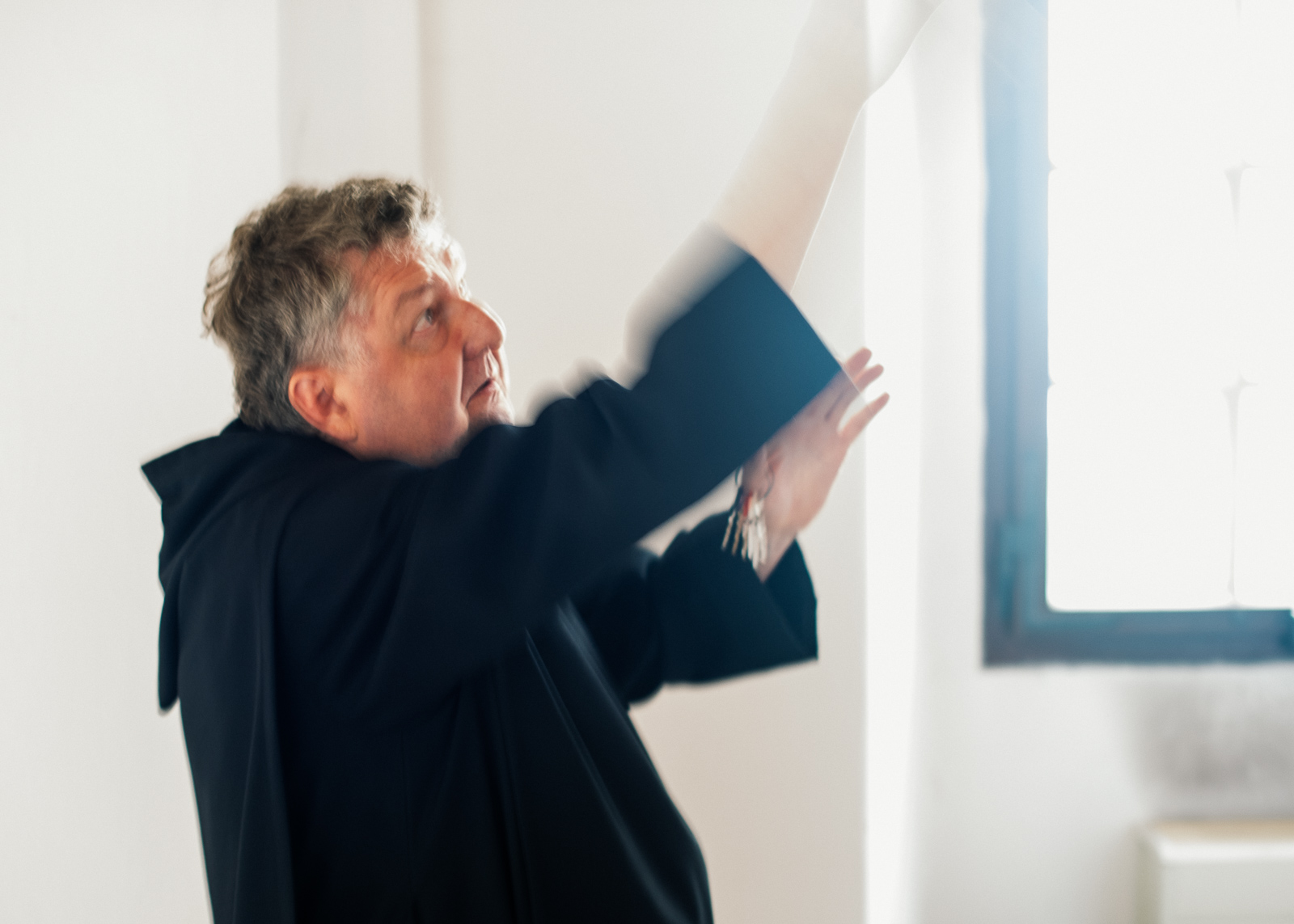 monk explaining the ceiling fresco in the monastery