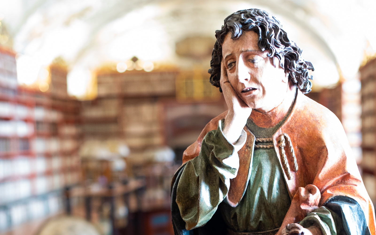 statue of a sad monk in the theological hall