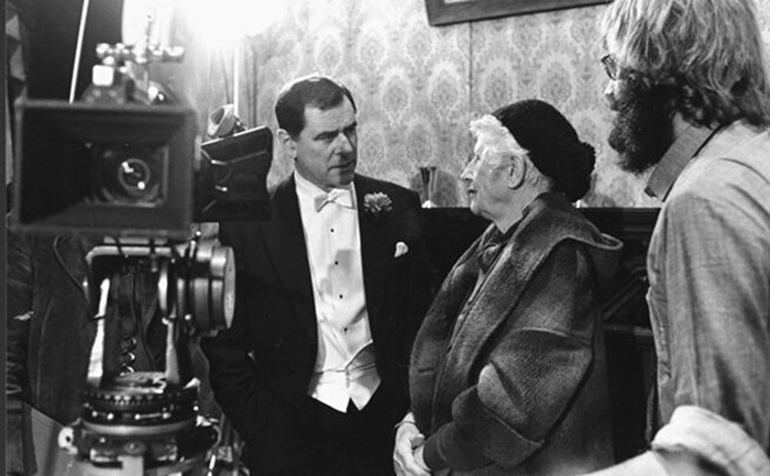 black and white photo of actor george baker and author ngaio marsh on set