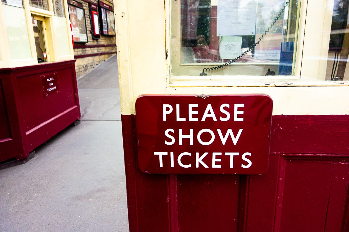 maroon signs at the keighley train station