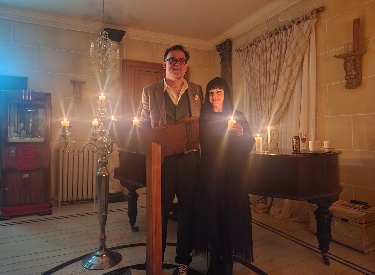 man and woman in a candlelit room